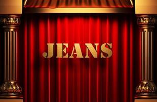 Jeans goldenes Wort auf rotem Vorhang foto