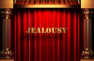 Eifersucht goldenes Wort auf rotem Vorhang foto