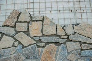 Beschichtung mit Steinen für eine ästhetische Wand foto