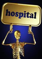 Krankenhauswort und goldenes Skelett foto