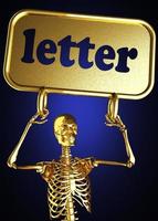 Buchstabenwort und goldenes Skelett foto