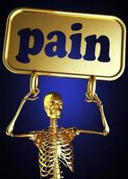Schmerzwort und goldenes Skelett foto
