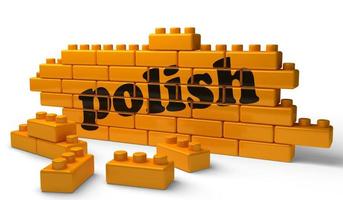 Polnisches Wort auf gelber Backsteinmauer foto