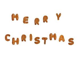 frohe weihnachten geschrieben mit lebkuchenkeksen foto