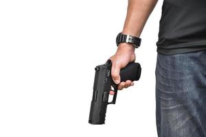 9-mm-Automatikpistole in der rechten Hand des Schützen, Konzept für Sicherheit, Raub, Gangster, Leibwächter auf der ganzen Welt. selektiver Fokus auf Pistole. foto