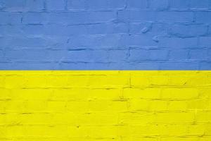 ziegelstruktur in den farben der gelb-blauen flagge der ukraine. ukrainisches Symbolikkonzept foto