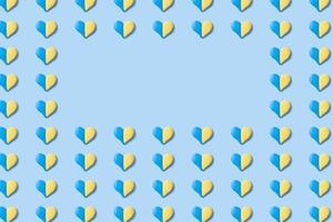Muster mit vielen Herzen in Form von gelb-blauen Farben der ukrainischen Flagge mit Kopierraum foto