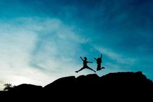 Silhouette der Teamführung, Teamarbeit und Teamwork und entzückende Silhouettenkonzepte foto