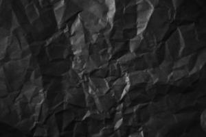 strukturierter, zerknitterter schwarzer Papierhintergrund. foto