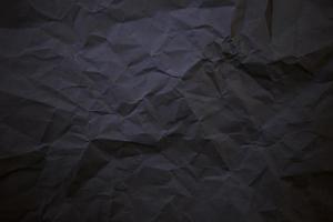 strukturierter, zerknitterter schwarzer Papierhintergrund. foto