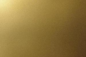 Licht auf goldener Metallplatte, abstrakter Texturhintergrund foto