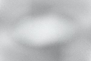 silberne folie glitzernde metallische wand mit zerkratzter oberfläche, abstrakter texturhintergrund foto