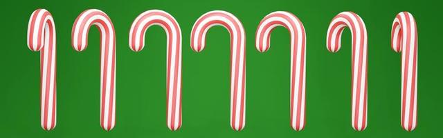 3D-Darstellung von Weihnachtsbonbons in rot-weißer Farbe auf grünem Hintergrund drehen sich in vielen Ansichten. 3D-Rendering. 3D-Darstellung. foto