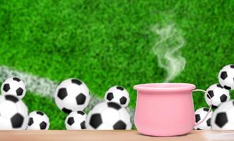 Tasse Kaffee mit Fußballhintergrund foto