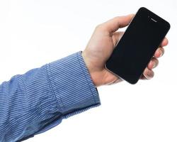 männliche Hand hält Smartphone foto