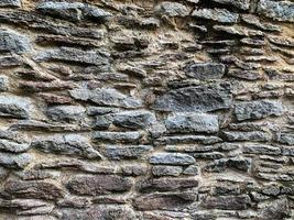 Hintergrund der alten Steinmauer. steinerne Kulisse foto