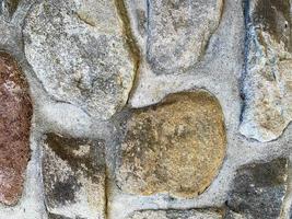 Hintergrund der alten Steinmauer. steinerne Kulisse foto