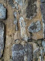 Hintergrund der alten Steinmauer. steinerne Kulisse foto