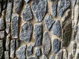 Hintergrund der alten Steinmauer. steinerne Kulisse foto