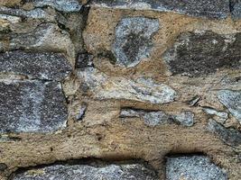 Hintergrund der alten Steinmauer. steinerne Kulisse foto