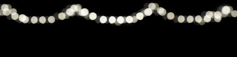 abstrakte unscharfe Lichtpunkte Bokeh auf festlichem dunklem Hintergrund für Deckblatt, nachts mit Licht dekorieren. foto