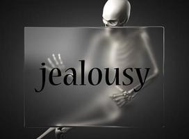 Eifersuchtswort auf Glas und Skelett foto