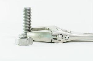 Schraubenschlüssel und Sechskantschraube und Sechskantmutter foto