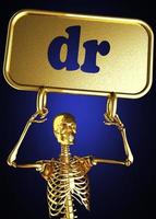 Dr.-Wort und goldenes Skelett foto