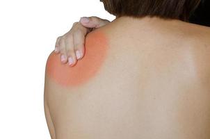 Frau mit Schulterschmerzen foto