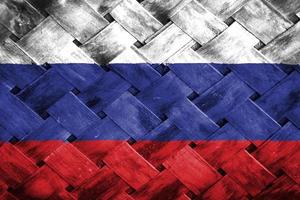 russland-flaggenschirm auf weidenholzhintergrund foto