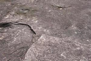 Der Steinhintergrund wurde vom Wind abgetragen, wodurch ein schönes Muster entstand. Marmorhintergrund mit Text foto