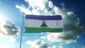 Flagge von Lesotho weht im Wind gegen den wunderschönen blauen Himmel. 3D-Rendering foto