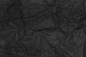 schwarze zerknitterte Papierstruktur als Hintergrund foto