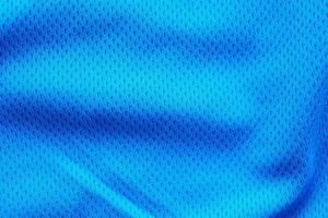 blauer stoff sportbekleidung fußball trikot mit air mesh textur hintergrund foto