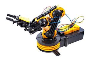 schwarzer und gelber Roboterarm foto