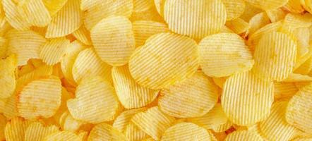 Knusprige Kartoffelchips Snack Textur Hintergrund foto