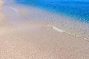 Meeresoberfläche und Sand foto
