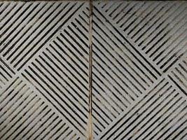 Hintergrund der grau gemusterten Textur von Bodenfliesen. foto