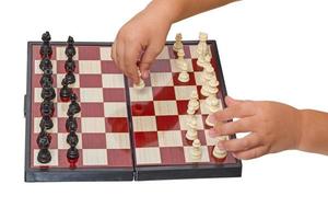 Kind macht eine Bewegung Schach Bauer foto