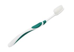 grüne Zahnbürste isoliert auf weißem Hintergrund foto