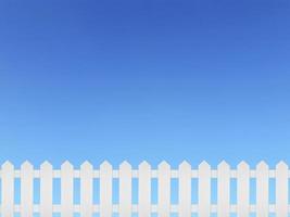 weißer Holzzaun und auf einem klaren, blauen Himmelshintergrund foto