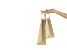 Hand halten braune Einkaufstasche mit Leerzeichen foto