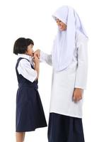 asiatisches muslimisches Mädchengruß foto