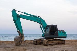 Bagger auf Sand foto