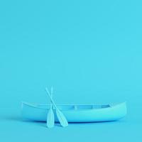 Kanu mit Paddeln auf hellblauem Hintergrund in Pastellfarben foto