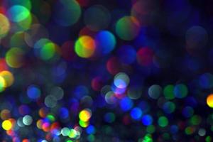 bokeh glitzer bunt verschwommener abstrakter hintergrund für geburtstag, jahrestag, hochzeit, silvester oder weihnachten foto