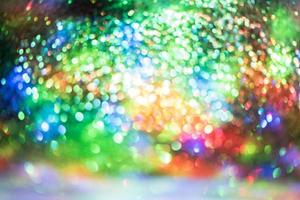 bokeh glitzer bunt verschwommener abstrakter hintergrund für geburtstag, jahrestag, hochzeit, silvester oder weihnachten foto