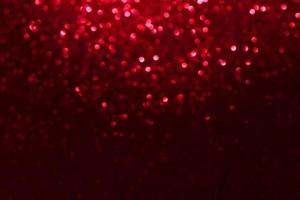 rote glitzernde bokeh-lichter verwischten abstrakten hintergrund für valentinsgrüße, geburtstag, jahrestag, hochzeit, neujahr und weihnachten foto