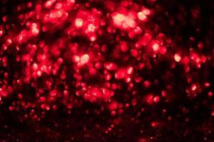 rote glitzernde bokeh-lichter verwischten abstrakten hintergrund für valentinsgrüße, geburtstag, jahrestag, hochzeit, neujahr und weihnachten foto