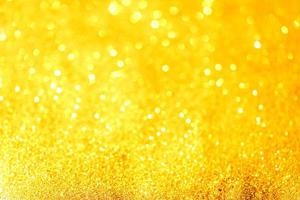 goldene glitzernde bokeh-beleuchtungsbeschaffenheit verschwommener abstrakter hintergrund für geburtstag, jahrestag, hochzeit, silvester oder weihnachten foto